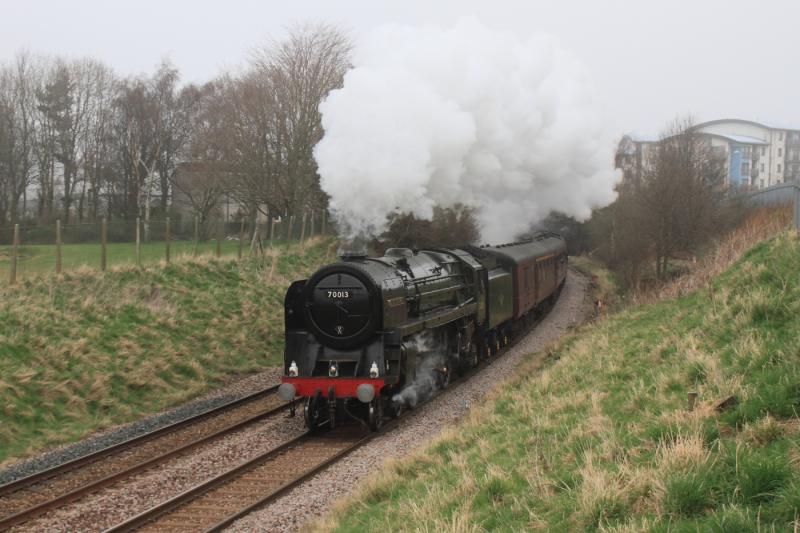70013 on 1Z34: 70013 on 1Z34 13.46 Edinburgh to Manchester passing Peffermill Playing fields on 24/03/2012. Haar not too bad. Photo of 70013 on 1Z34