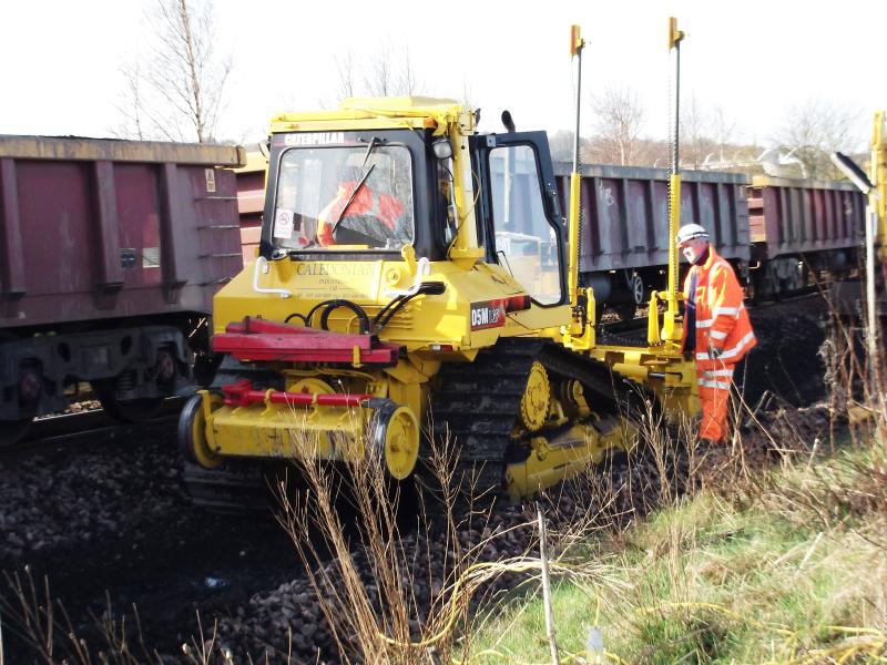 a shot of the bulldozer at Carmuirs : This bulldozer was moving the old ballast along so that the other track machines could lift the ballast onto the train. Taken on 1st April 2012. Photo of a shot of the bulldozer at Carmuirs