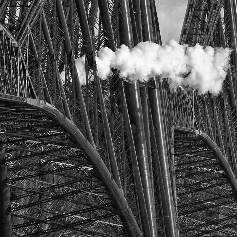 Steam on the Forth Bridge: Somewhere within this web of freshly painted steel is 46115 'Scots Guardsman' hauling the second SRPS Photo of Steam on the Forth Bridge
