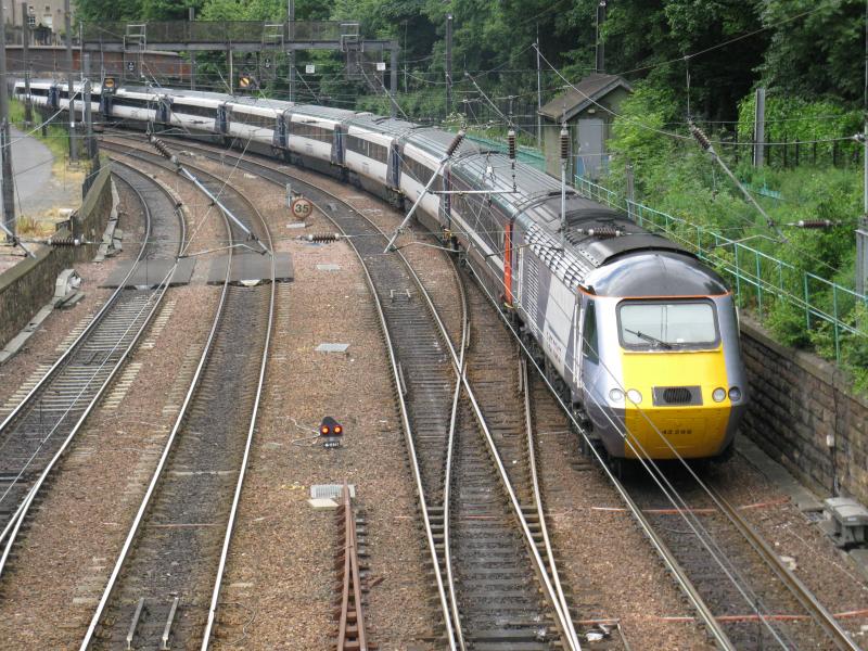 HST: HST approaching Edinburgh Waverley as seen from the footbridge in Princes Street Gardens. The train is seen passing by Edinburgh Castle. Photo of HST