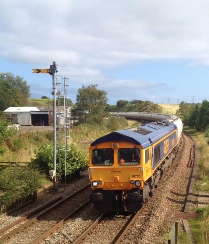 66735 6S45 diverted Alcans passing Brampton: Photo of 66735 6S45 diverted Alcans passing Brampton