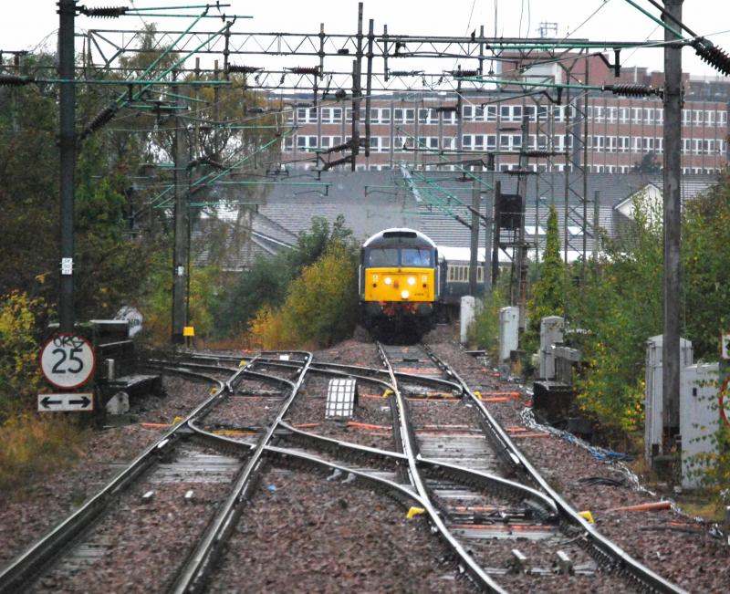 47828 & 818: 47828 (LeadinG) & 812 start the climb to Kings Park Station with the Glasgow Central - Southampton Boat Train on Tue 16th Oct 2012 on a miserable wet day Photo of 47828 & 818