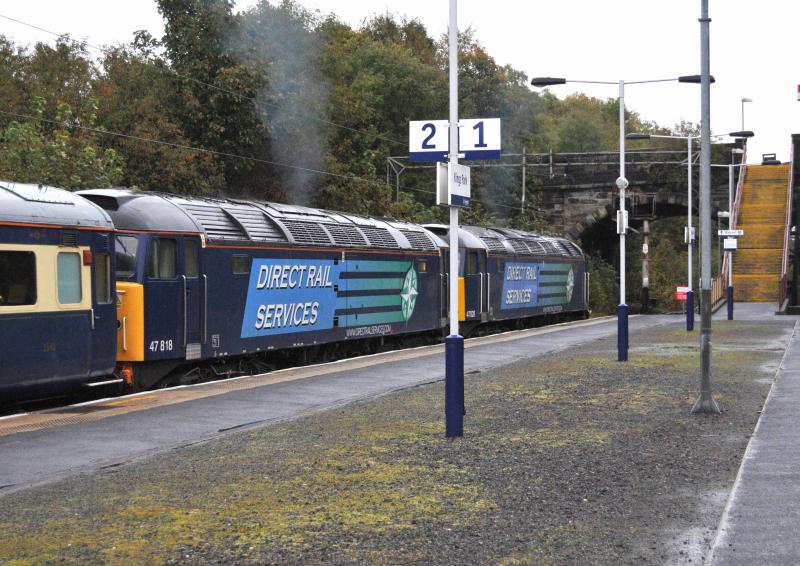 47828 & 818 Prepare to depart: GC - Southampton Boat Train Tue 16th Oct 2012 wait to get the right of way to depart from Kings Park Station.
818 gave a good amount of clag as it was opened up Photo of 47828 & 818 Prepare to depart