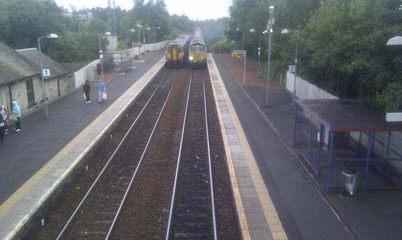 2 Trains in 1: A class 66 with cement wagons in consist. The 1622 first Scotrail service to Glasgow Central. taken at West Calder. Taken somewhere in August Photo of 2 Trains in 1