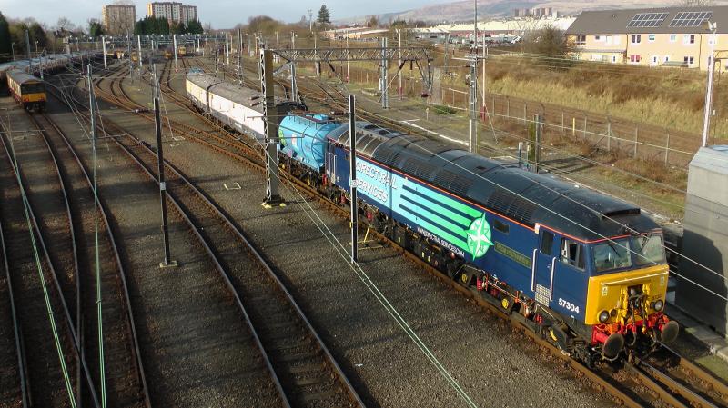 57304 Yoker EMU Depot 17/02/13:
57304 shunts the stock ready to take 334002 to Kilmarnock for refurbishment Photo of 57304 Yoker EMU Depot 17/02/13