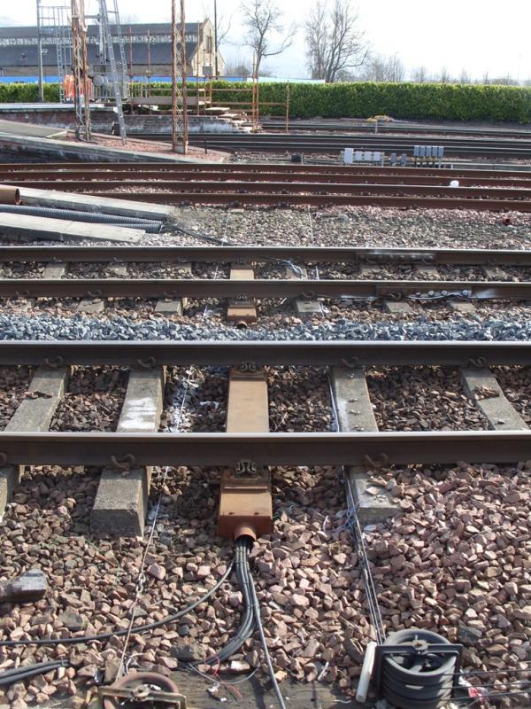 Steel sleeper with cable running through it: Replacement sleeper noted south end of of Stirling platforms 2 and 3. Photo of Steel sleeper with cable running through it
