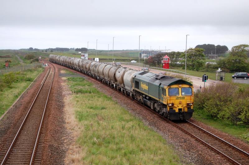66605 6A65 Oxwellmains - Aberdeen 5/6/2013: A dirty 66605 eases past the site of the former Elliot Junction station with a relatively lightly loaded cement train for Aberdeen. Photo of 66605 6A65 Oxwellmains - Aberdeen 5/6/2013