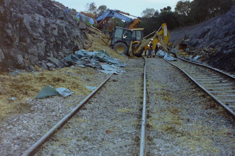 Abronhill Tunnel opening out (1): Following the track being exposed after the spoil and straw bales were removed: formation heave due to over drilling for explosives. Photo of Abronhill Tunnel opening out (1)