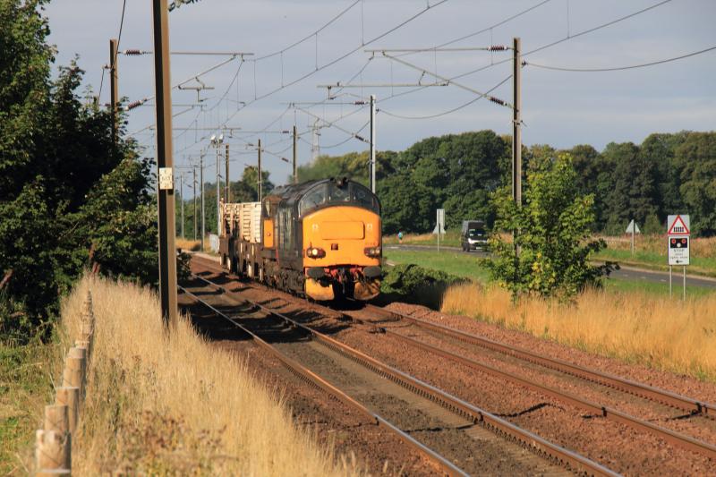 6S43: 37218 leading 20304 on 6S43 06.42 Carlisle Kingmoor to Torness Power Stn passing St Germains level Crossing on 30/08/2013 in full sun Photo of 6S43