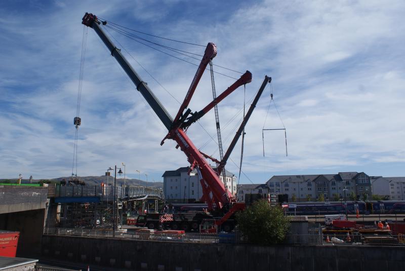 The view at 11.00 at Shore Street on 14.09.13: The view at 11.00 at Shore Street on 14.09.13. The big crane holds a 40cubic metre skipon strain while debris is loaded into it. Photo of The view at 11.00 at Shore Street on 14.09.13