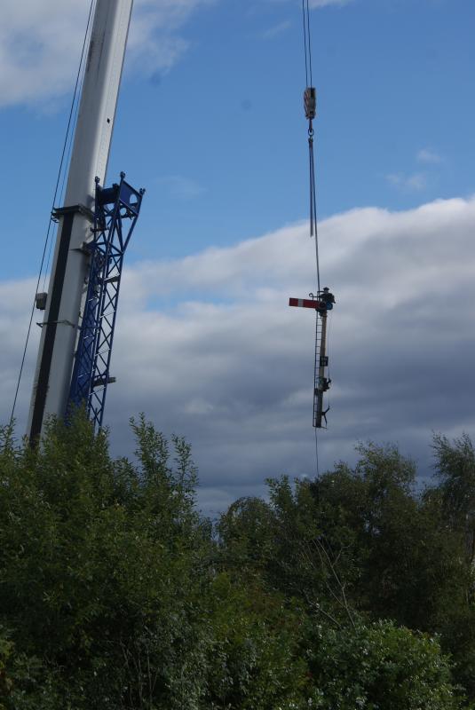 SM48's freedom flight is almost over: Old Stirling signal SM48's freedom flight is almost over as it starts to get lowered into part of Macrae & Dick's land. 05.10.13 Photo of SM48's freedom flight is almost over