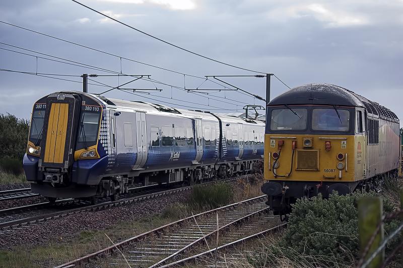 380110: 380110 Passing 56087 at Prestwick International working 2K76 to Glasgow Central on Tuesday 29th October Photo of 380110