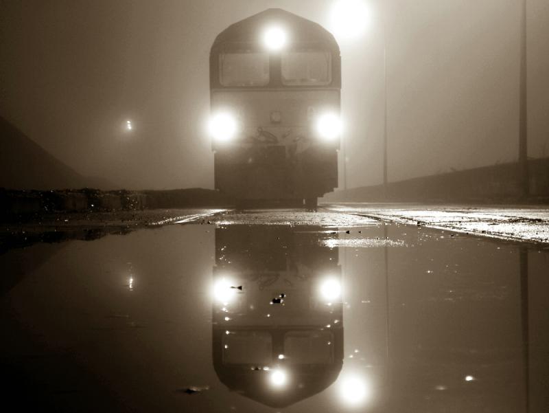 Sepia shed: 66245 waits for its train of HAAs to be loaded with imported coal amongst the puddles of a foggy Leith Docks. Photo of Sepia shed