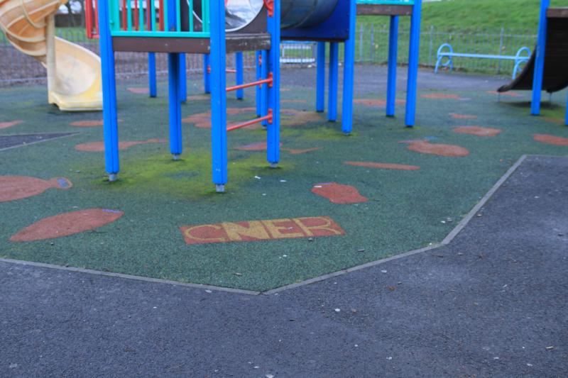 GNER logo: This GNER logo is part of the soft surface in a children's playground about 50 metres from the fence at the side of Craigentinny T & RSMD. I had walked past the playground Photo of GNER logo