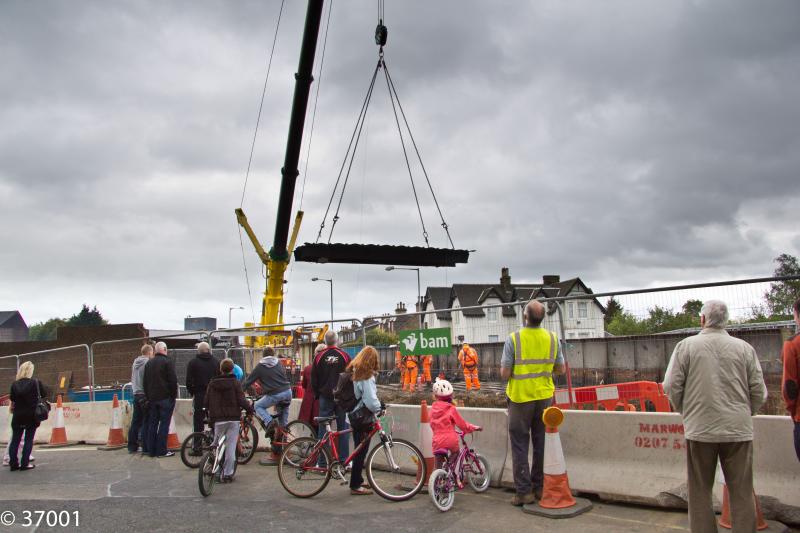 Look up! A bridge section is lifted clear at Larbert: The latest section to be removed from the rail bridge at Larbert is lifted skywards as the watchers watch-on Photo of Look up! A bridge section is lifted clear at Larbert