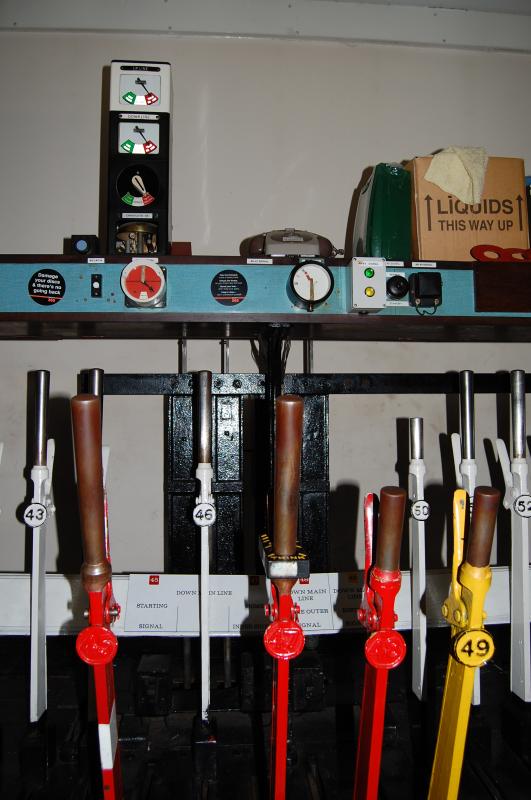 Carnoustie block + levers: The block instrument at Arbroath for the Up/Down lines Arbroath/Carnoustie with the signal repeaters for Down line signals AH48 & AH45 showing Photo of Carnoustie block + levers