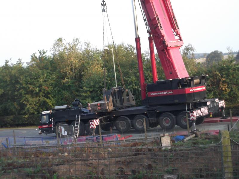 crane on site: crane has installed new footbridge over railway during the night. Photo of crane on site