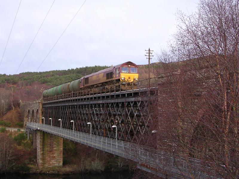 Shin Viaduct - Lairg Tanks #2: Shin or Oykel viaduct with Southbound Lairg tanks in Feb 2006. The footpath/footbridge between Invershin (far side) and Culrain can be clearly seen. Photo of Shin Viaduct - Lairg Tanks #2