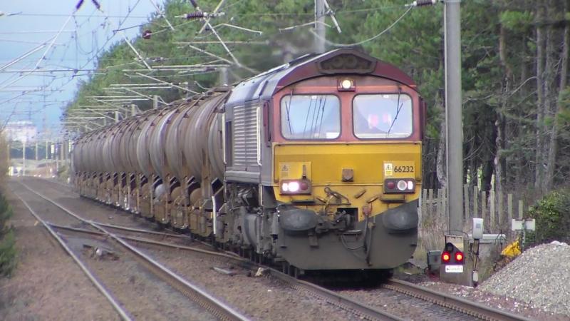 Irvine Tanks: 66232 slows on the approach to Barassie station to enter the yard working the 6R52 Mossend Yard - Irvine Caledonian Papermill tank train. 5th Jan 2014 12:00 Photo of Irvine Tanks