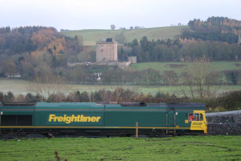 66605 at Borthwick:
At the foot of Borthwick Bank on the Waverley route. Returning the empty ballast Photo of 66605 at Borthwick