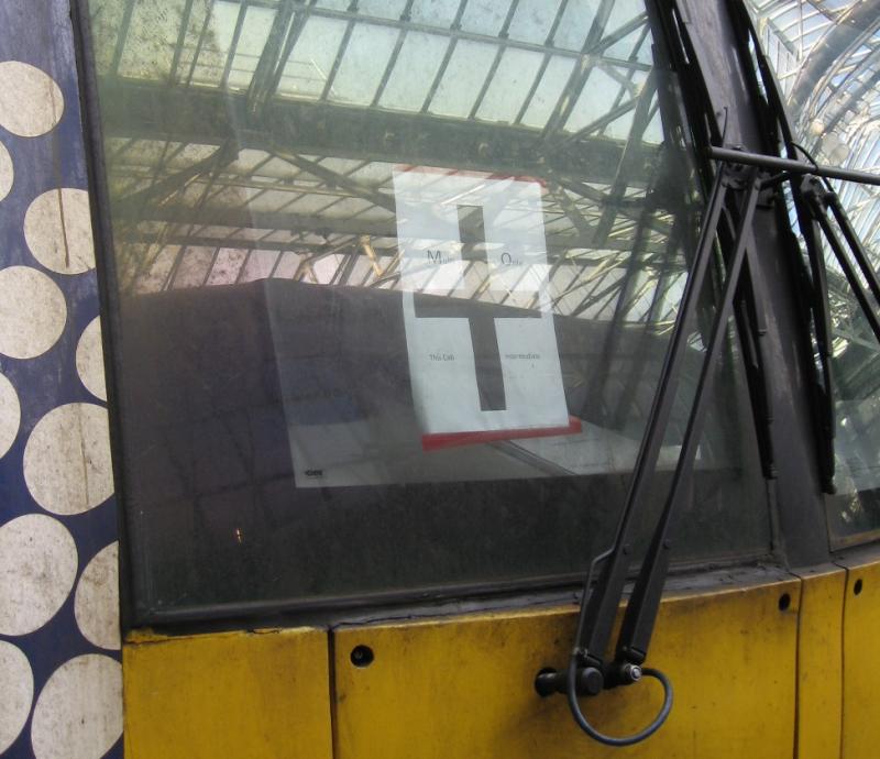 Multiple-Only : Sign in the cab window of 334032. Cross symbol with Photo of Multiple-Only