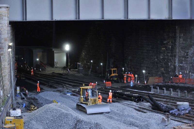 Queen Street Station Model Layout: The way the workers are standing makes them look like a scale model railway layout rather than a real life 1:1 scale Photo of Queen Street Station Model Layout