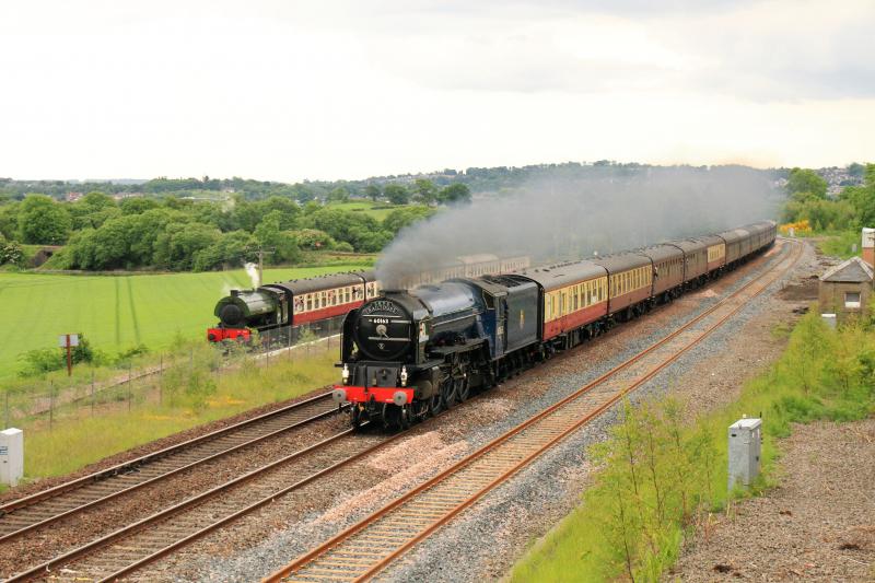 Tornado passing Manuel station: 60163 Tornado passing Manuel with 0-6-0 in the platform on a clockwise Forth Circle tour on 16/06/2013 Photo of Tornado passing Manuel station