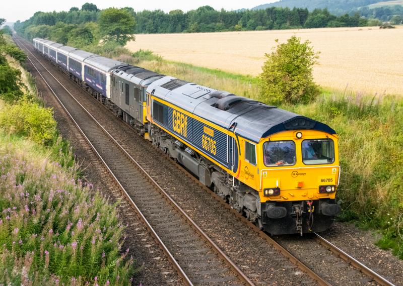 66705: 66705 with 73966 pass Forgandenny with the Inverness portion of the Highland sleeper, running four hours late. Photo of 66705