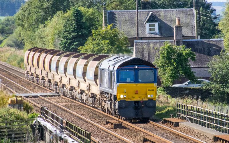 66430: 66430 with autoballasters heads for Brora, seen passing Forteviot LC. Photo of 66430