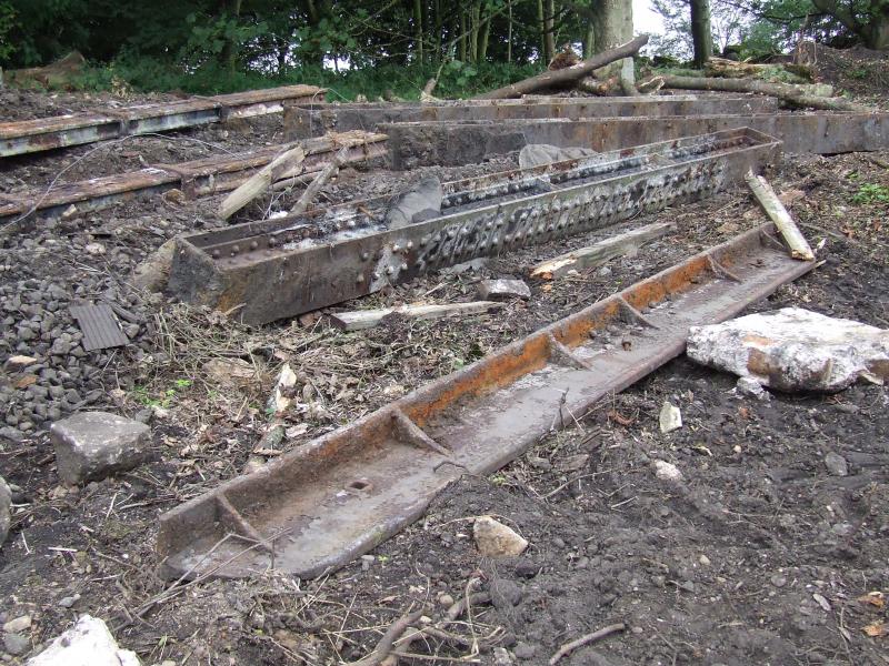 The previous Bridge 135: Beams from the former bridge 135 waiting on a visit from the scrappie. Photo of The previous Bridge 135