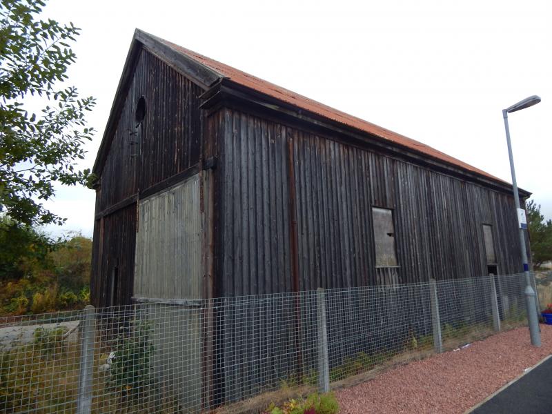 Brora Goods Shed: The original wooden Highland Railway goods shed still stands in fairly good condition. Photo of Brora Goods Shed