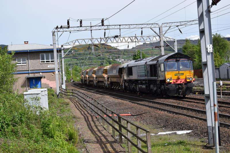 Millerhill-Loch Eil Outward Bound 17 May 2017: Ex DRS Class 66 66413 now Freightliner tnt 66621 passes through Dumbarton Central running some 3 mins early Photo of Millerhill-Loch Eil Outward Bound 17 May 2017