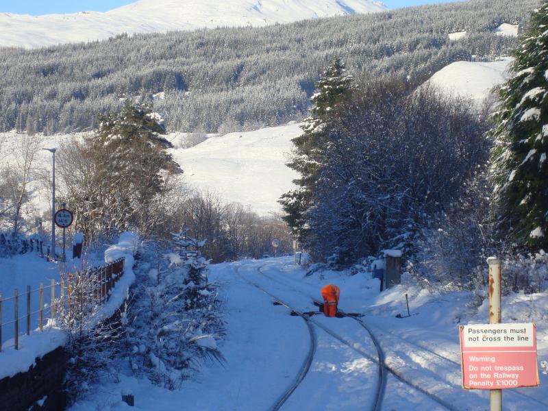 Sticking Points at Crianlarich: Network rail worker freeing up points at the north end of Crianlarich Station on 20th Jan 2018. Snow depth in area was +12 inches. No points heaters here! Forecast for -11C here tonight! Photo of Sticking Points at Crianlarich