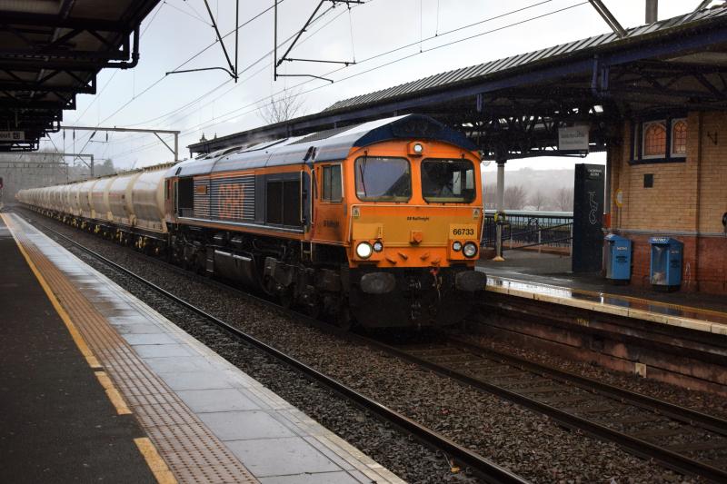 6E45 Dumbarton Central 24.1.18: GBRf 66733 Cambridge PSB with the usual load of PCAs heads east through Dumbarton Central on 14.1.18 running about 5 mins late Photo of 6E45 Dumbarton Central 24.1.18