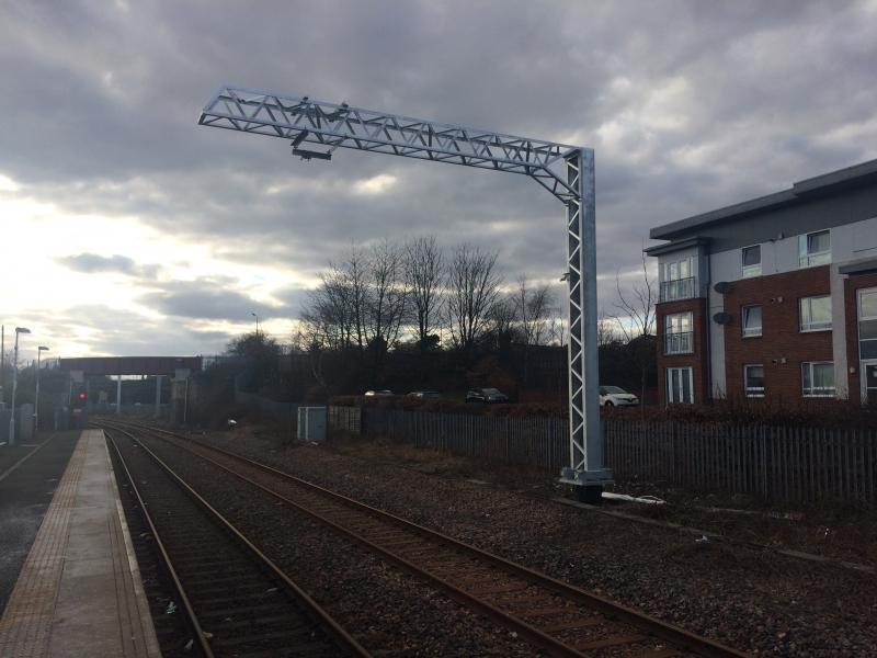 Alloa OLE Mast: Masts are now in place along the full length of the Alloa branch (with one or two exceptions). Note the cantilever arm and insulator sitting at base of the mast awaiting fitting. Photo of Alloa OLE Mast