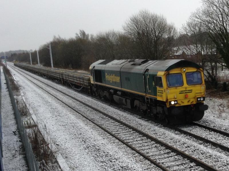 Class 66: T & T class 66's 66597 and 66502 on the Millerhill to Dyce on Wednesday 4 th April on a cold and snowy day. Photo of Class 66