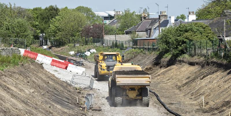 STONEYWOOD PASSING TRAFFIC 19.5.18 A.jpg: LKG TO DYCE WITH TRUNCATED RAILS BEHIND TRUCK Photo of STONEYWOOD PASSING TRAFFIC 19.5.18 A.jpg