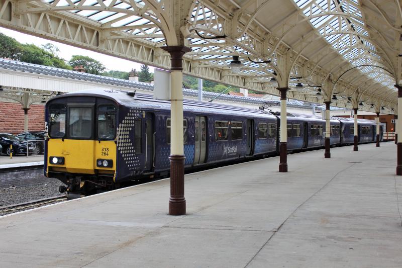 318264 at Wemyss Bay: 318264, on the Wemyss Bay class 314 diagram on 17 July 2018, seen waiting to depart as the 13:57 to Glasgow Central. Sufficiently rare that the driver also took a photograph. Photo of 318264 at Wemyss Bay
