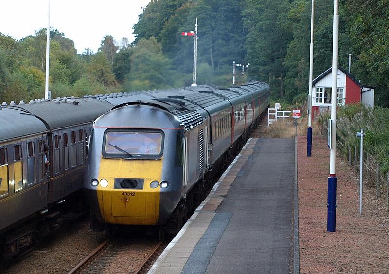 Unusual crossing at Dunkeld: 43312 leading northbound 1S15 at Dunkeld passing 1Z48 returning day trip from Inverness to Newcastle on 20/09/08 Photo of Unusual crossing at Dunkeld