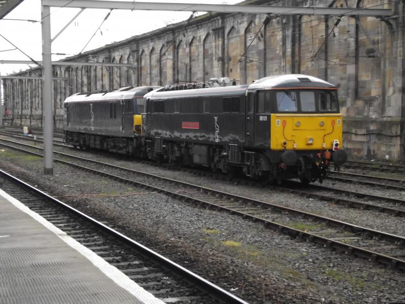 86101 at Carlisle: Now wearing Caledonian Sleeper Livery, GBRf operated 86101 and 92014 waits at Carlisle with 0Z86 on a staff training run on Saturday 6th April 2019. Photo of 86101 at Carlisle