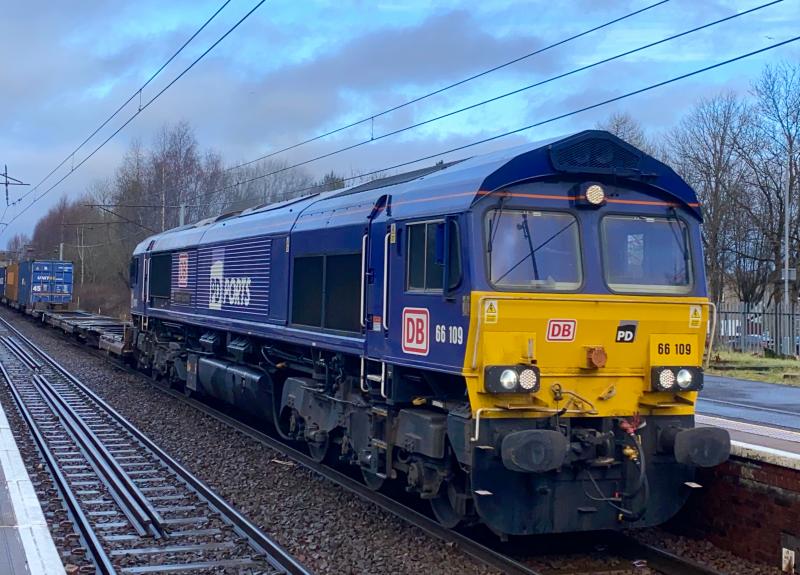 Perpetual PD: A common sight on DB operated intermodals to and from Tees, PD Ports liveried DB 66109 works the 4E98 Mossend - Tess Dock through a dull Holytown station (20/02/2021) Photo of Perpetual PD