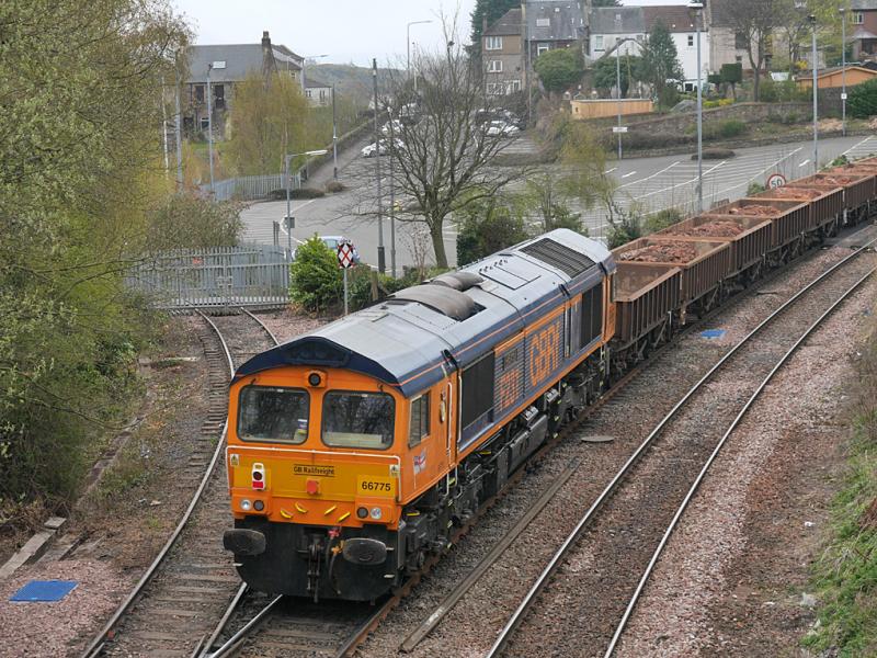 Inverkeithing 66775: GBRf 66775 brings up the rearof 6K30 Laurencekirk - Millerhill on 18 April 2021, passing the disused Rosyth Dockyard branch. 66738 was leading. Photo of Inverkeithing 66775