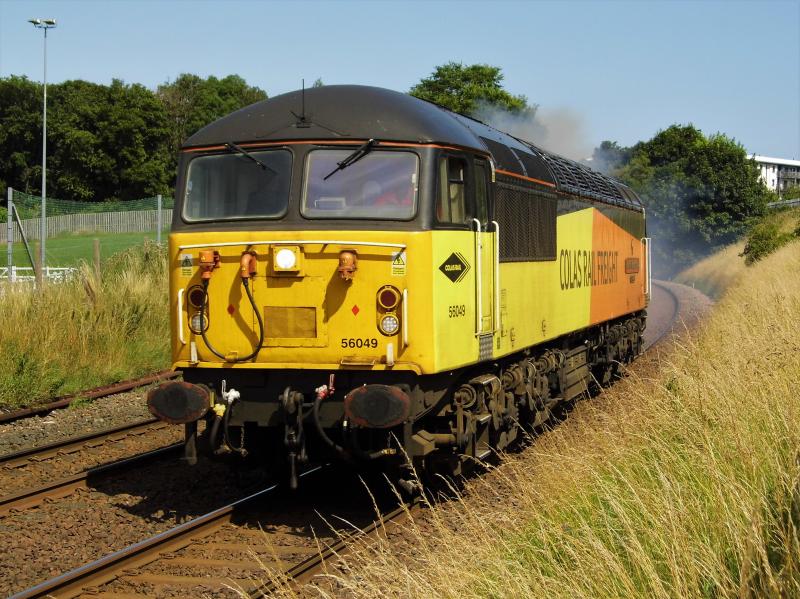 56049 02/08/21: 56049 on 0Z56 1400 Millerhill- Grangemouth opens up passing Peffermill on the Edinburgh suburban line early at 1328 on 02/08/21. 56049 had arrived in Millerhill on 0S31 from Doncaster with 70808. Photo of 56049 02/08/21