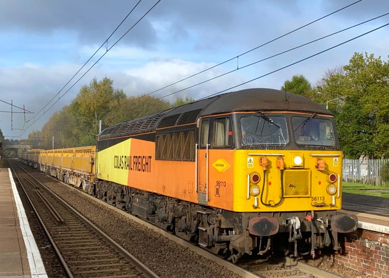 Grid Going Solo: After having dropped off classmate 56105 at Mossend, 56113 presses onward working the 6K20 Rannoch - Carlisle Yard engineers, seen powering through Holytown in a lucky spell of sunshine. (07/11/2021) Photo of Grid Going Solo