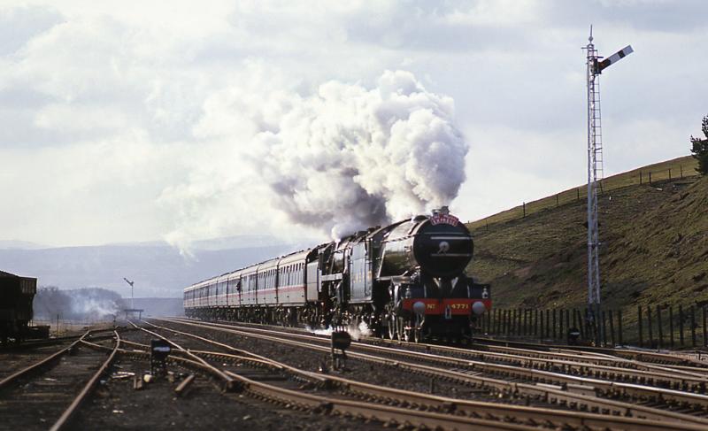EMI Music Express approaching Blackford: 7 April 1986. EMI chartered a train to take recording artists from Edinburgh Waverley to Gleneagles. The train then continued to Perth as ECS. Photo of EMI Music Express approaching Blackford