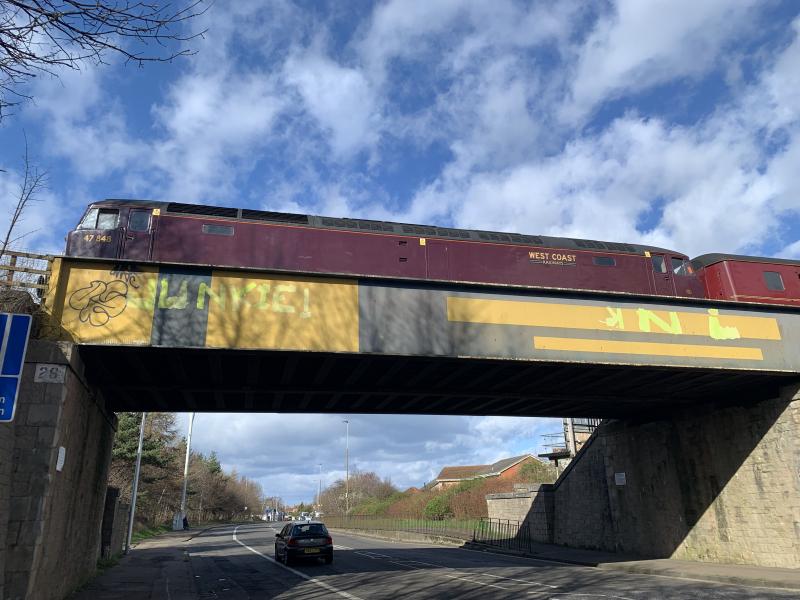 47848 5Z48 23/03/24: 47848 pauses on the bridge over the road at Duddingston Park on the Edinburgh suburban line on 23/03/24, working 5Z48 1355 Waverley to Joppa Straight ECS. 44871 was on the other end of the stock. Phone photo. Photo of 47848 5Z48 23/03/24