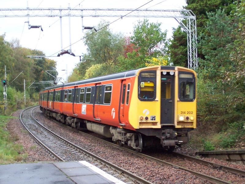 orange and black: 314 202 at whitecraigs station heading towards glasgow, one of the last 314s to be repainted.(photo Greig Gibson) Photo of orange and black
