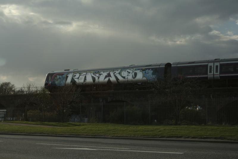 Graffiti'd Turbo: Whilst waiting on the steam tours at Dundee, spotted this unit heading over bridge before the specials. 12 April 2009 Photo of Graffiti'd Turbo