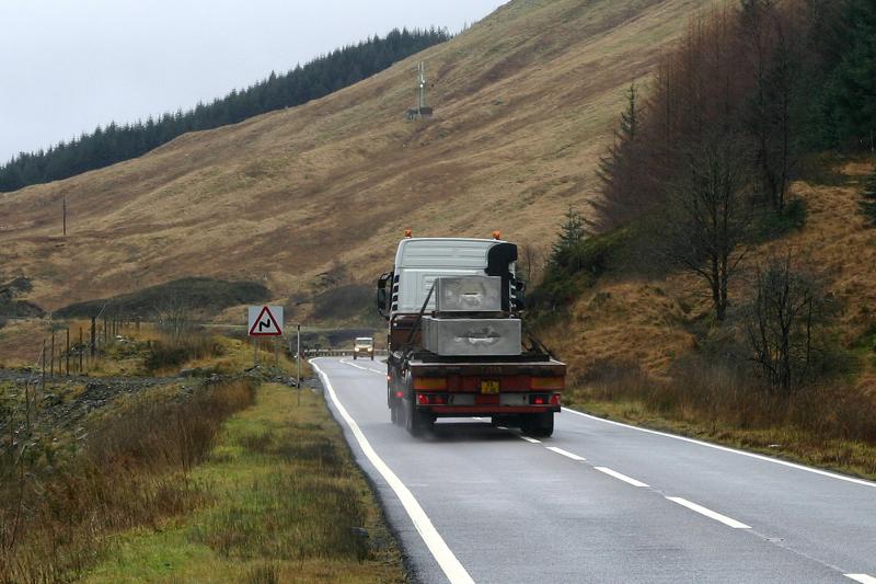WH lorry: A landslip between Horseshoe Curve and County March Summit which closed WHL resulted in aluminium slabs from Fort Willian Alcan smelter being transported by road, This load has just passed the scene of the slip on 19/12/06 Photo of WH lorry