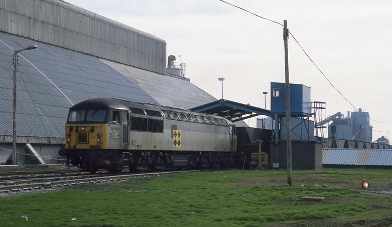 56104 in Leith Docks: In 1991 coal was being exported through Leith Docks. 56104 was the first 56 into Leith Docks with a train of loaded HAAs. In those days you could just drive in and take photographs. 29 March 1991 Photo of 56104 in Leith Docks